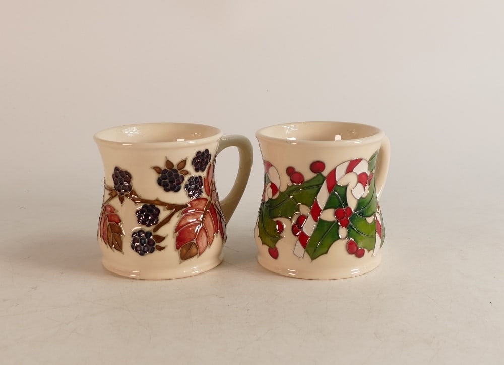 Two Moorcroft mugs to include Bramble (crazed) and Christmas Candlesticks (2): Two Moorcroft mugs to include Bramble (crazed) and Christmas Candlesticks (2)