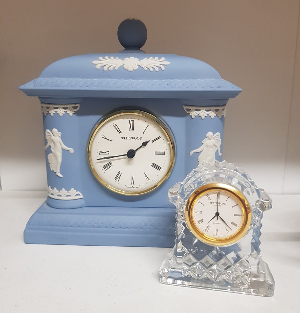 A Wedgwood Blue Jasperware Mantleclock together with a small Waterford Crystal example. (2) (1 of 1)