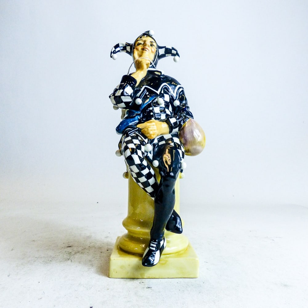 Royal Doulton early figure Jester HN45, black & white chequered tunic, dated 1925. (1 of 6)