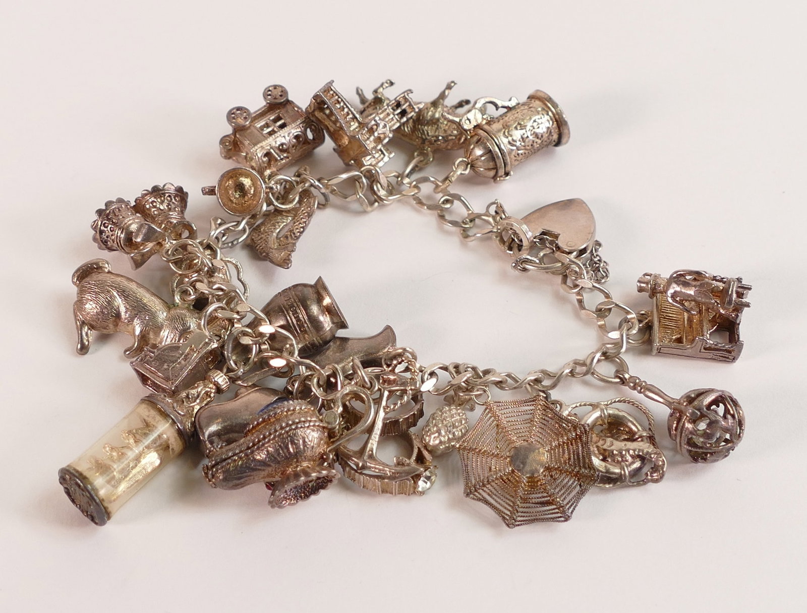 Silver charm bracelet, 69.3g.: Silver charm bracelet, 69.3g.