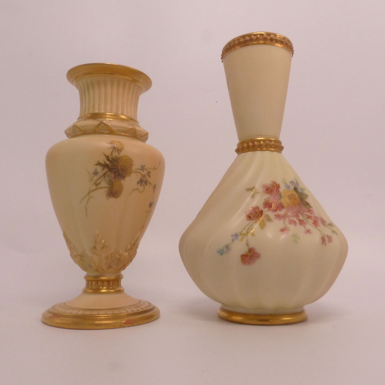 Royal Worcester, Two Blush Ivory Porcelain Vases. Painted with Floral Sprays. One green and one with: Royal Worcester, Two Blush Ivory Porcelain Vases. Painted with Floral Sprays. One green and one with puce 'Royal Worcester' backstamp. Height of tallest: 16cm (2)