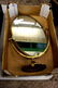 A large ornate brass free standing mirror