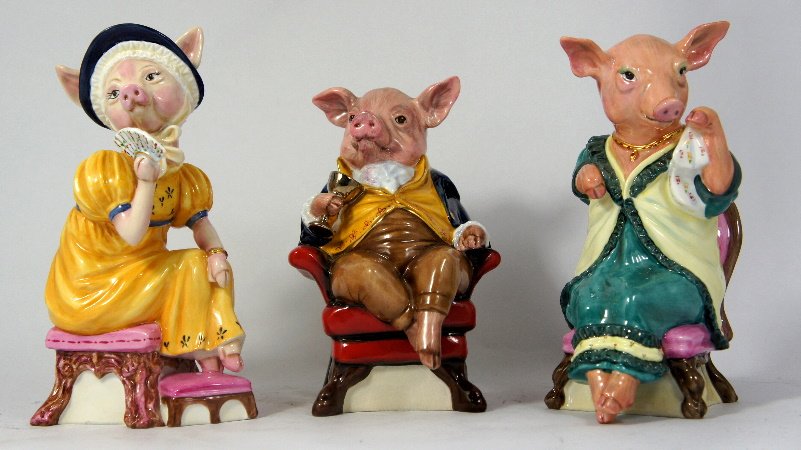 Royale Stratford Comical Pig Models of a Seated Gentlem: Royale Stratford Comical Pig Models of a Seated Gentleman Pig (Cracked) Seated Lady Pig with Handkerchief and Seated Lady Pig with Fan, tallest 20cm (3)