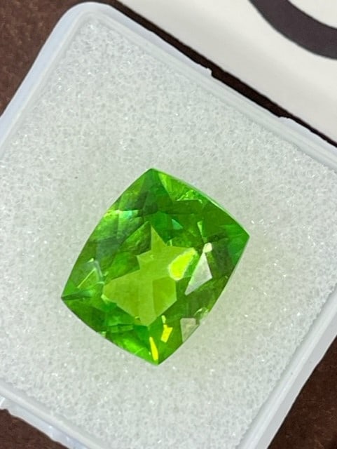 Beautiful 9.95 Ct. Cushion Cut Peridot Loose Gemstone from Pakistan: The Peridot was Cleopatra's favorite Gemstone.ÿ We just read an article about Peridots from Pakistan that are green with a slight yellow tint are the highest quality ones an that is exactly this one 
