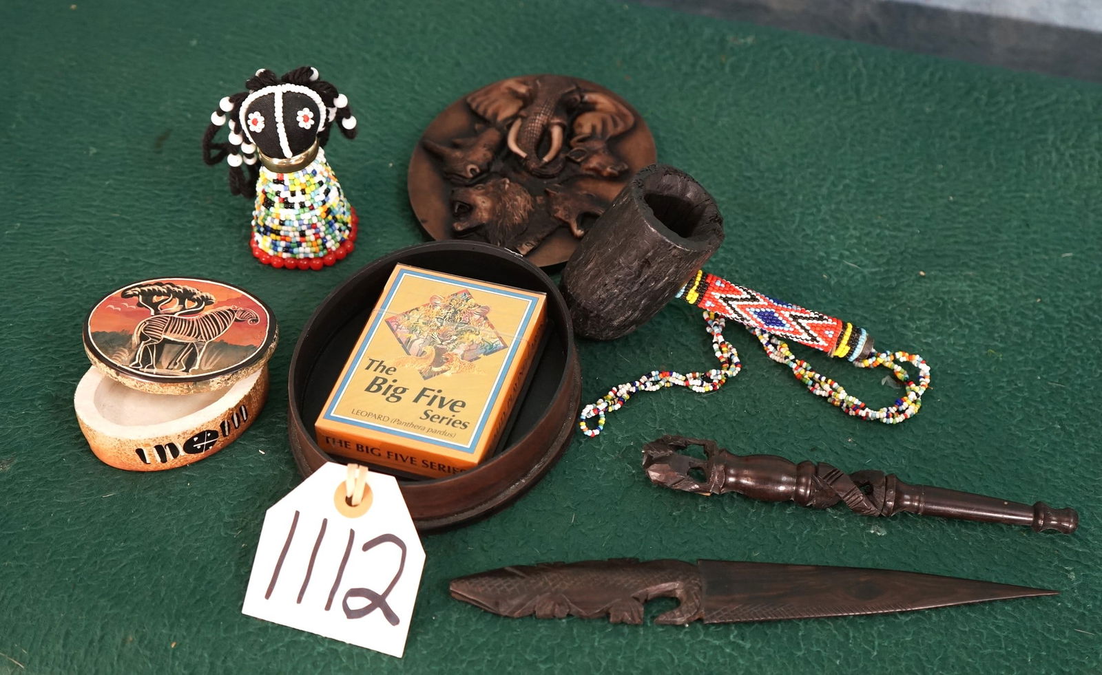Six Cool African Items from Zimbabwe: Here we have an oval shape case with the African Big Five carved on the top with Wildlife Playing Poker cards inside. Also a Zebra Pill Box, and a Beaded African Kids Doll, and a Carved Wood Smoking P