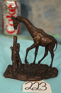 Giraffe Solid Bronze by the Franklin Mint: This is a good looking and well detailed Giraffe. This bronze would look fine on the Coffee Table or any place else for that matter. It measures 5 1/2" tall, and it is 5 1/4" long.?