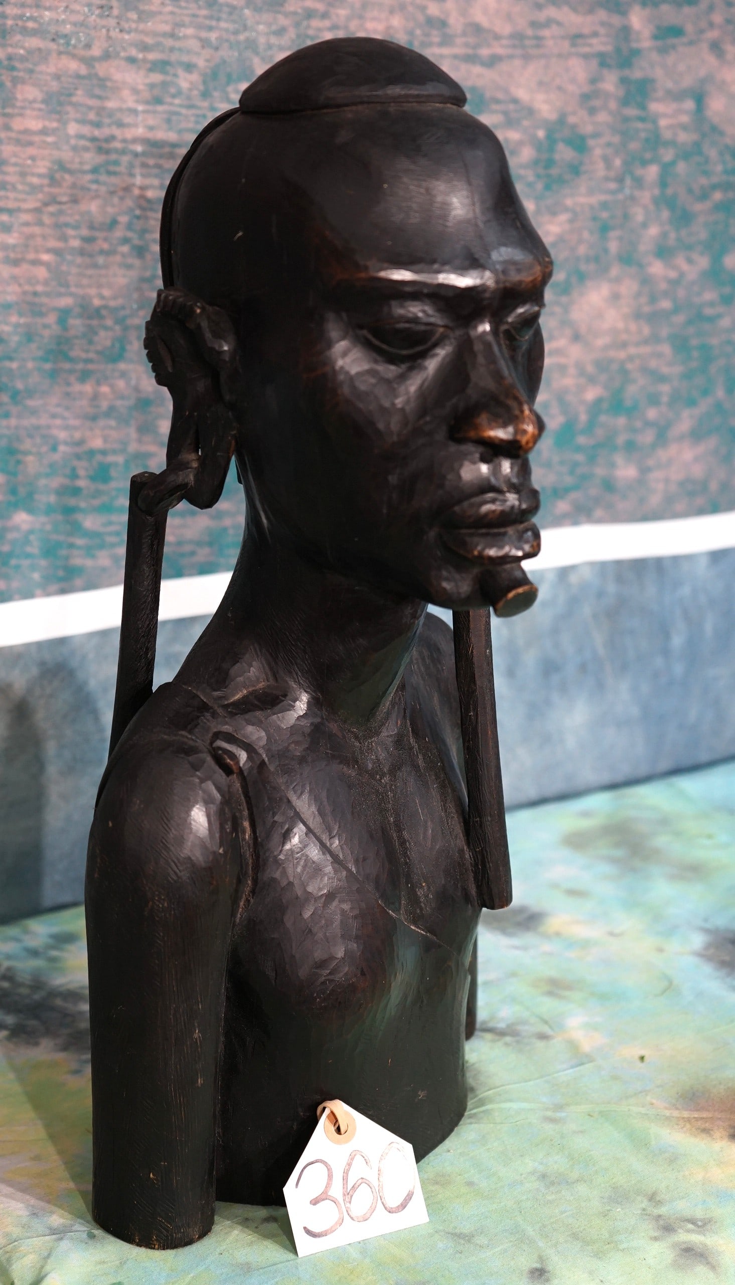 Hand Carved Masai Man Shoulder Bust made from Ironwood: This statue is in excellent condition and very well made. It is solid and heavy. This one is very well detailed. The Masai are native to Kenya and Tanzania.
