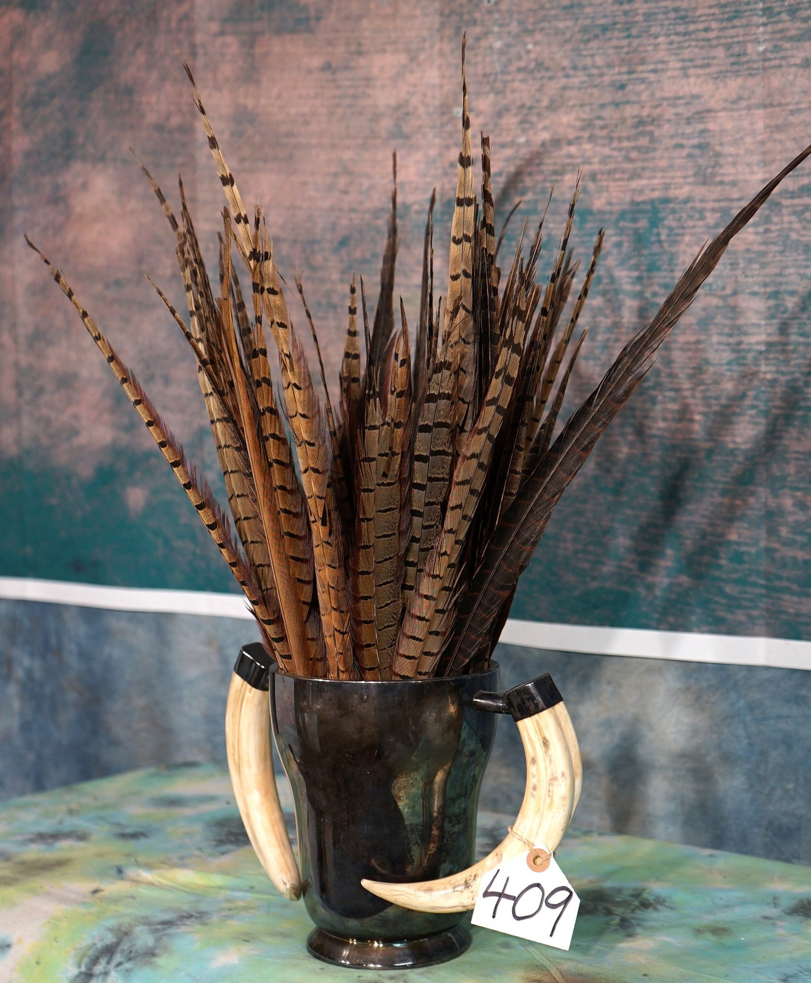 Beautiful Silver Cup with Warthog Tusk Handles Filled with Pretty Pheasant Tail Feathers (1 of 2)
