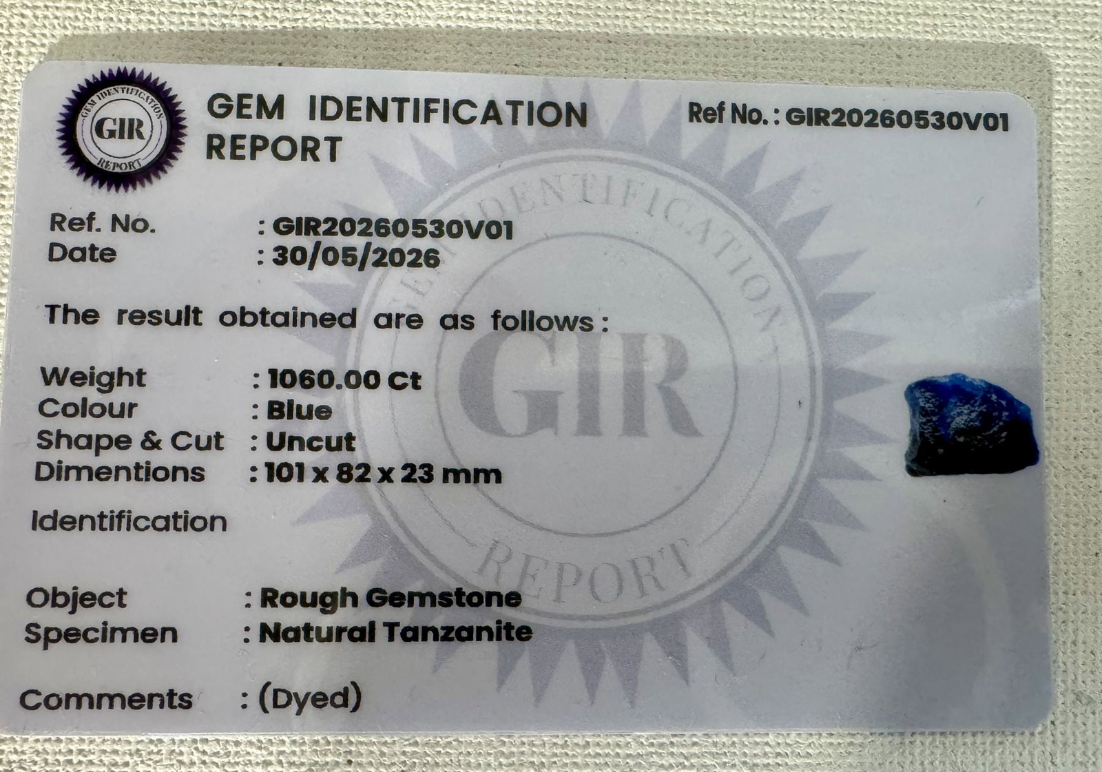 Authentic Rough Cut 1,060.00Cts. Natural Tanzanite Gemstone with Identification Report Card: This is what Tanzanite looks like when it is removed from the mines. Tanzanite has been going up in value. It comes in shades of light, and dark blue, and purple. This big Chunk can make a whole lot o