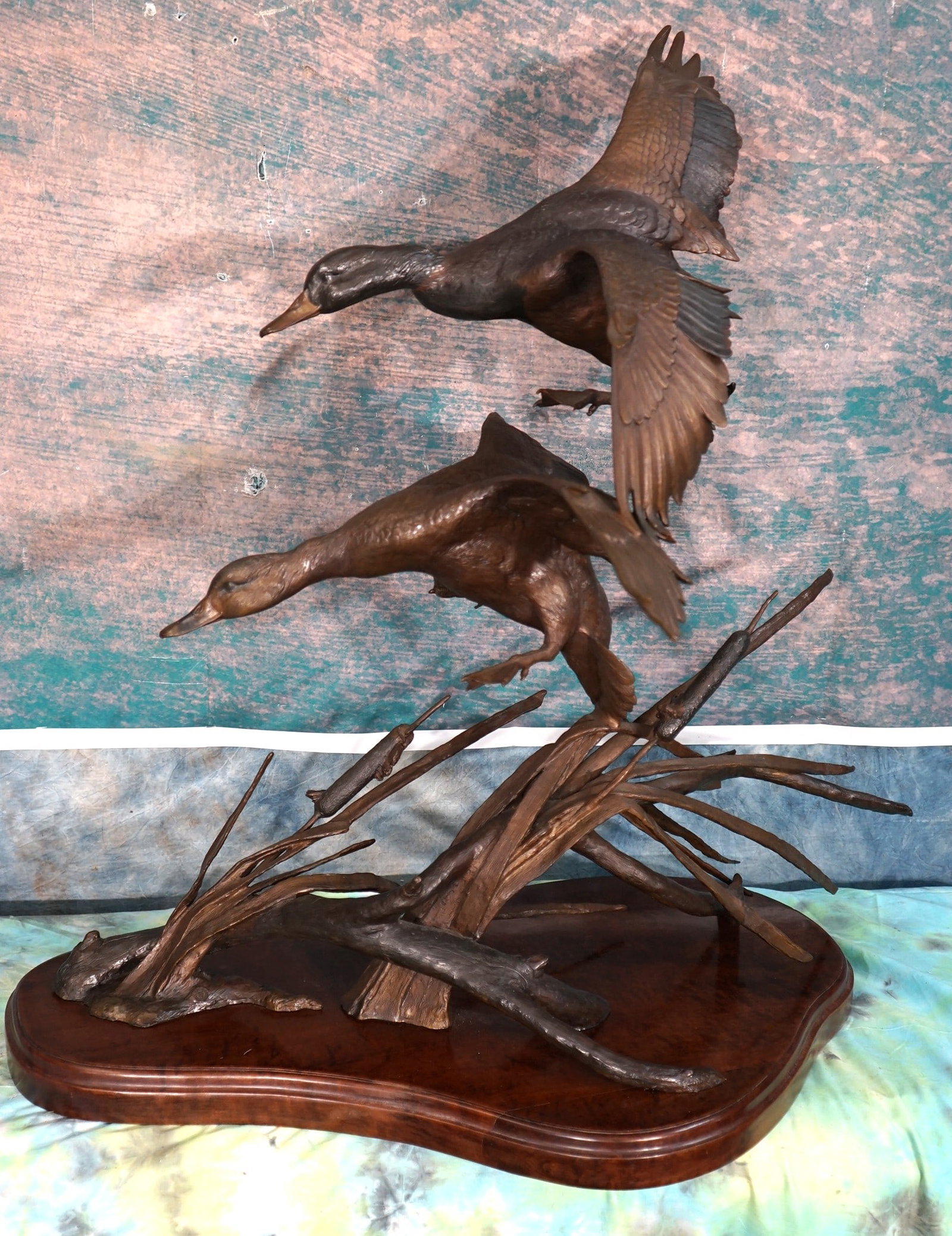 Large & Beautiful Bronze of Two Mallard Ducks "Gale Winds" by Ronnie Wells: This is a very high quality Bronze of a pair of Mallards. The Bronze measures 35 1/4" high, and 32" long. The Drake is up top, and the Hen is below. These Ducks as well as habitat is highly detailed.