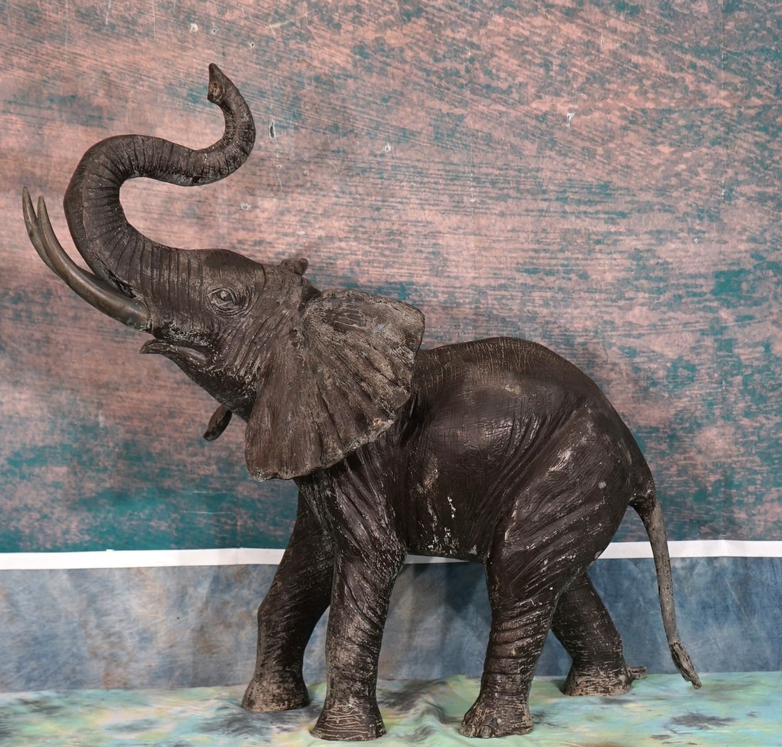 African Elephant Bronze: This Bronze measures 32" tall, and 32" long. This Bronze is hollow inside. It has very nice detail, and this Bronze will look fantastic in a Trophy Room, or next to a fireplace. This type of Bronze wi