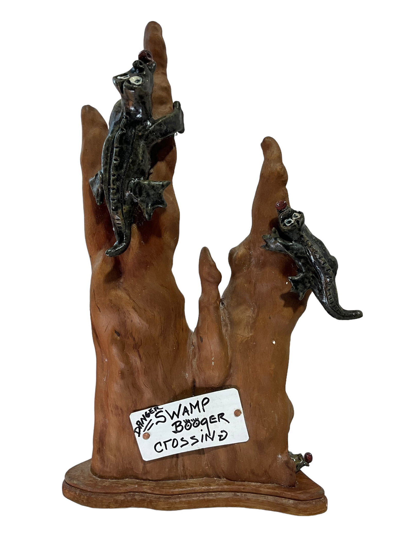 Mike Hanning SWAMP BOOGERS 2003: Mint Condition. 17 inches tall x 10 inches wide. Signed on bottom. 3 pottery swamp boogers mounted on petrified wood.
