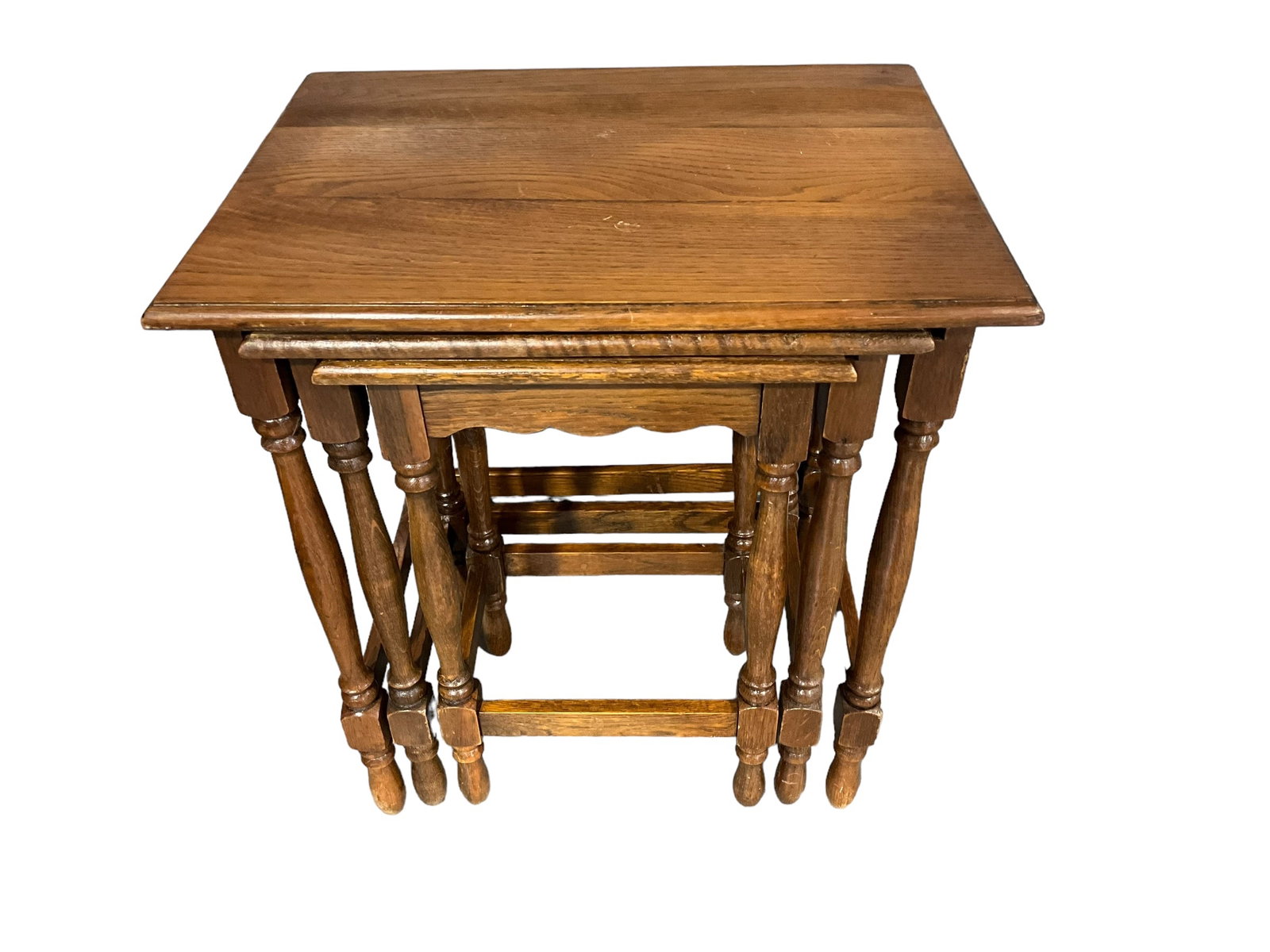 Vintage Oak Nesting Tables: A nice trio. Nesting tables are in great condition. Measurements are as follows: Largest table is 20" tall x 17.5" 13.5". Middle table is 19" tall x 14" x 11". Smallest table is 18" tall x 11.25" x 9.