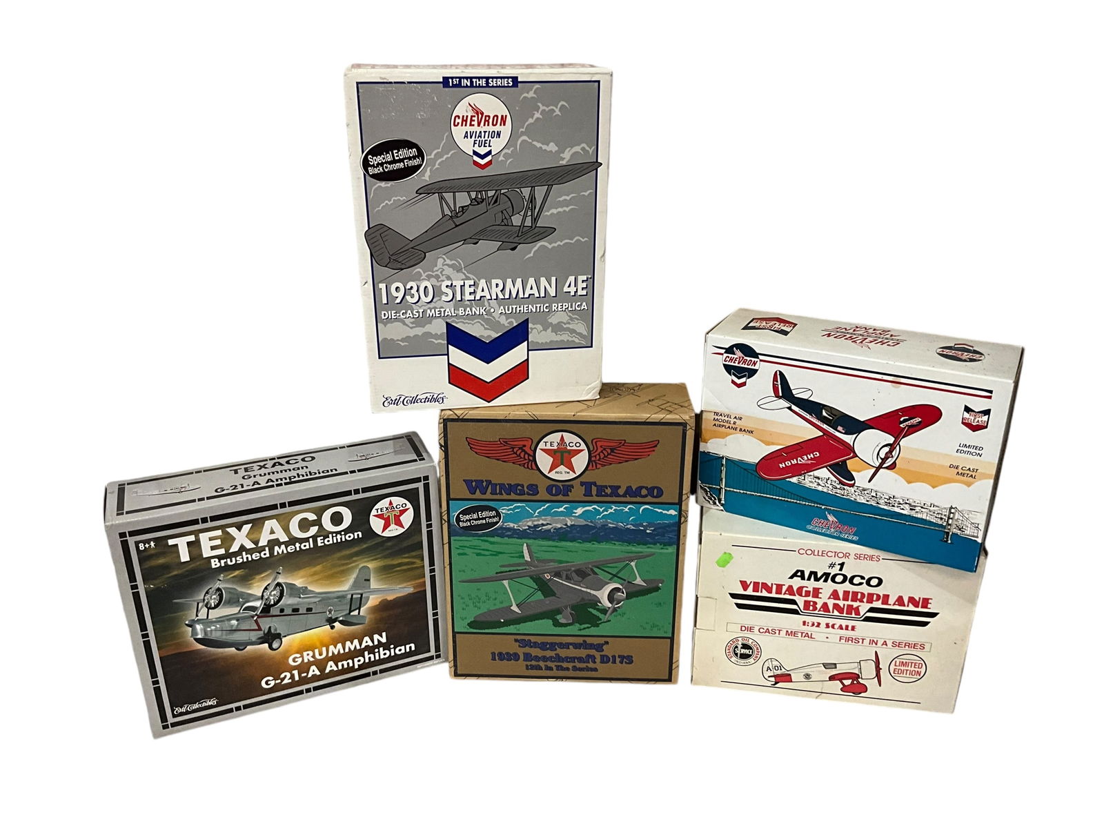 Lot of Five Die Cast Metal Chevron Texaco Amoco Airplane Banks: All new in box in excellent condition.1) #1 Amoco Vintage Airplane Bank - 1/32 - Spec Cast2) Chevron Aviation Fuel 1930 Stearman 4E - Ertl3) Texaco Grumman G-21-A Amphibian - Ertl4) Wings of Texaco St