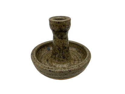 Lanier Meaders Candle Holder: Excellent condition. Firing crack on bottom. Initialed in script on bottom. Stands 4 inches tall by 5 inches wide.