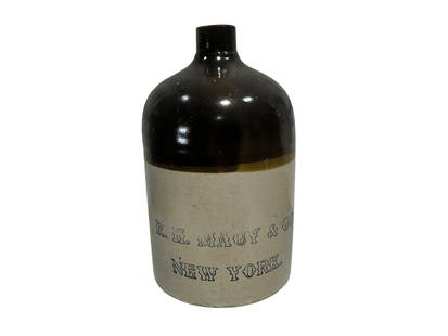 R.H. Macy New York Stoneware Jug: Overall good condition. One chip at bottom. Stands 11 inches.