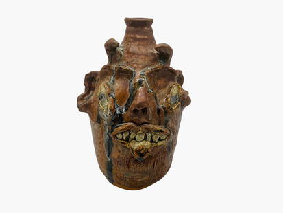 Marie Rogers Devil Face Jug: Mint condition. A scarce devil from Marie featuring slanted eyes, tongue out and excellent runs. A freaky jug indeed. Signed