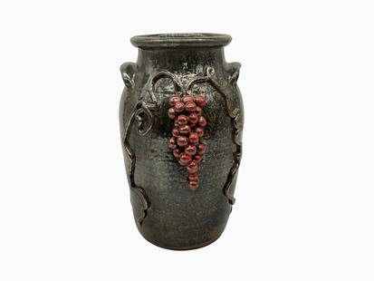 Wayne Hewell Grape Decorated Vase: Mint condition. Grape clusters and applied decorations on both sides. Signed on bottom. Stands 11.25 inches tall. Lip has a 5 inch diameter.