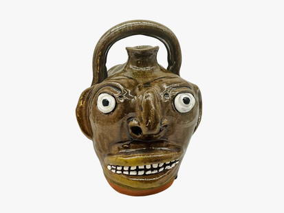 Mike Hanning #1 Double Face Monkey Jug: Mint condition. Edgefield style. Signed and numbered on bottom. Stamped on body. Stands 7.5 inches tall. 7.5 inches long and approximately 5.5 inches wide.