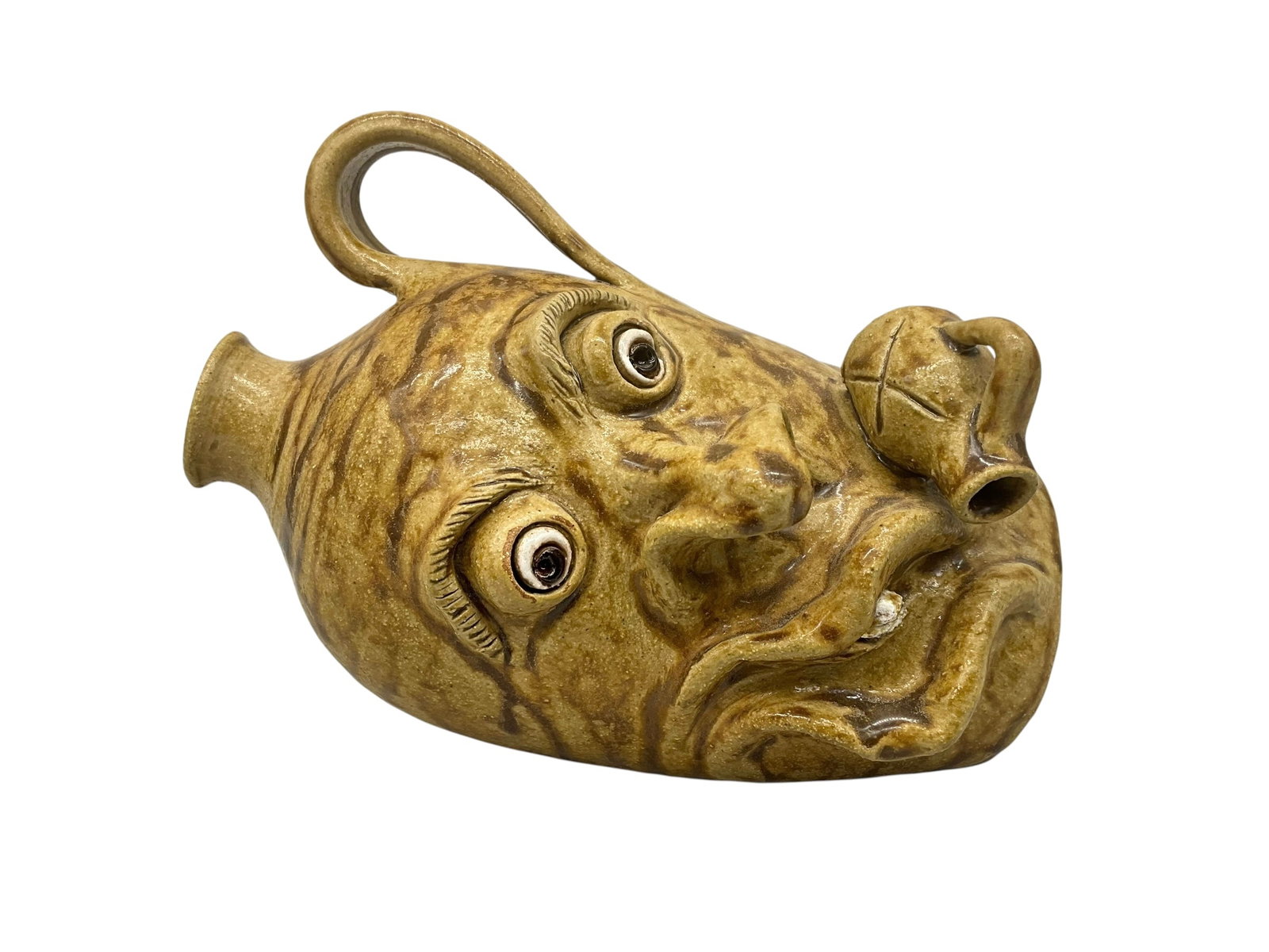 Mike Williamson 1st Laying Rock Tooth Face Jug: Mint condition. Named 'Archie'. Signed on bottom and also on small applied jug. Stands 5.5 inches tall, 7 inches long and approximately 4 inches wide.