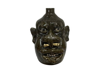 Rare Lanier Meaders Bone in Nose Face Jug: An exceedingly rare, museum quality face jug by Lanier Meaders. Exquisite incised decorations from forehead, in between eyes, around large nose and down cheeks. Bone going through septum of nose and a