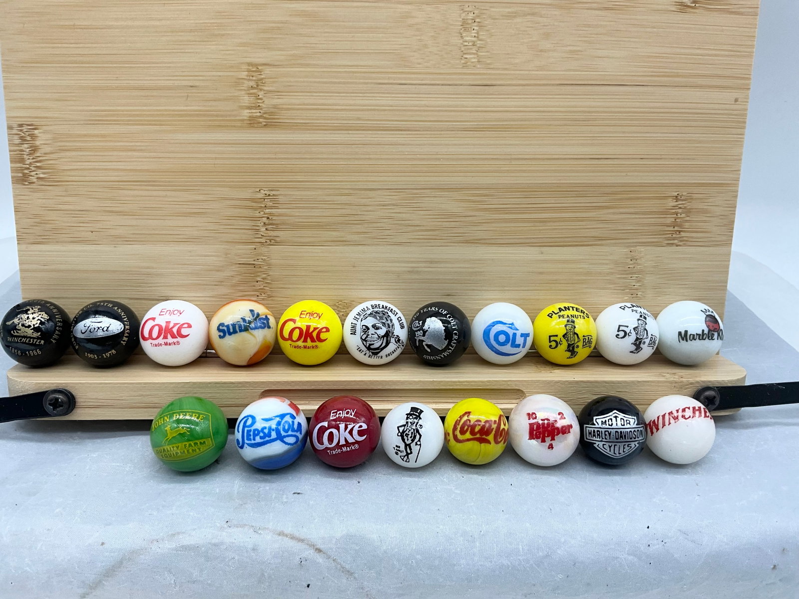 19 Advertising Marbles Aunt Jemima + Winchester + Colt + Harley + John Deere +++: See photos for complete list.