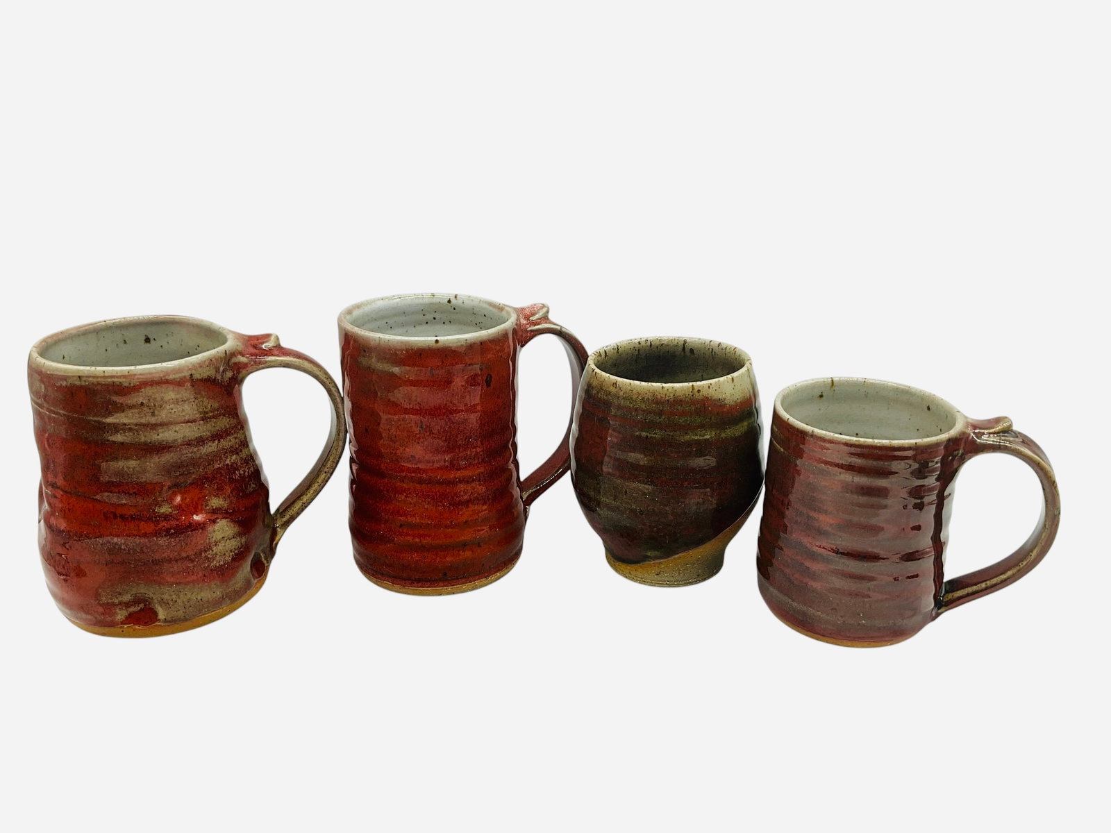 Four Jeff Bishoff Pottery Mugs: Mint condition. All signed on bottom. Smallest measures L 4.75" x W 3.25" x H 4". Largest measures L 5" x W 3.5" x H 5".