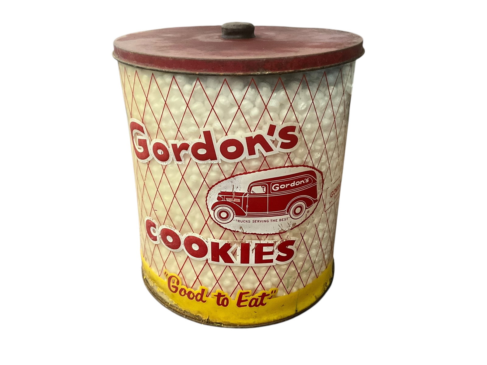 Large GORDON’S COOKIES Counter Top Container: Used condition. 11 3/4 inches tall. Plastic container body. Metal Top. A few cracks and needs cleaning.