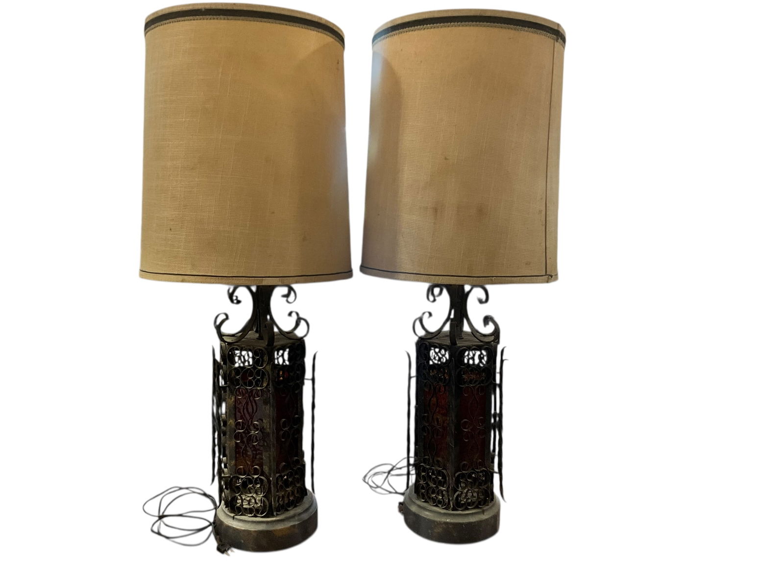 Pair MCM Spanish Revival Brutalist Lamps: Working condition. Red and Amber glass in tact. A great gothic pair. With shades, each lamp stands 37.75 inches tall. Without shades, lamps stand 30 inches tall. Lamp base has a diameter of 8 inches.