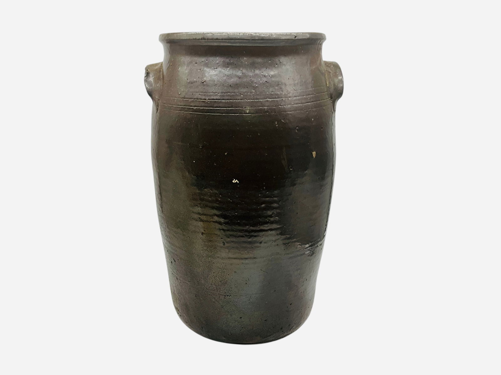 Cleater Meaders Sr. 4 Gallon Churn: Overall great condition.Small firing crack on rim. Minor chipping on base. An excellent piece with 4 incised lines around. Measures 16"H x 9.5"L x 8"W