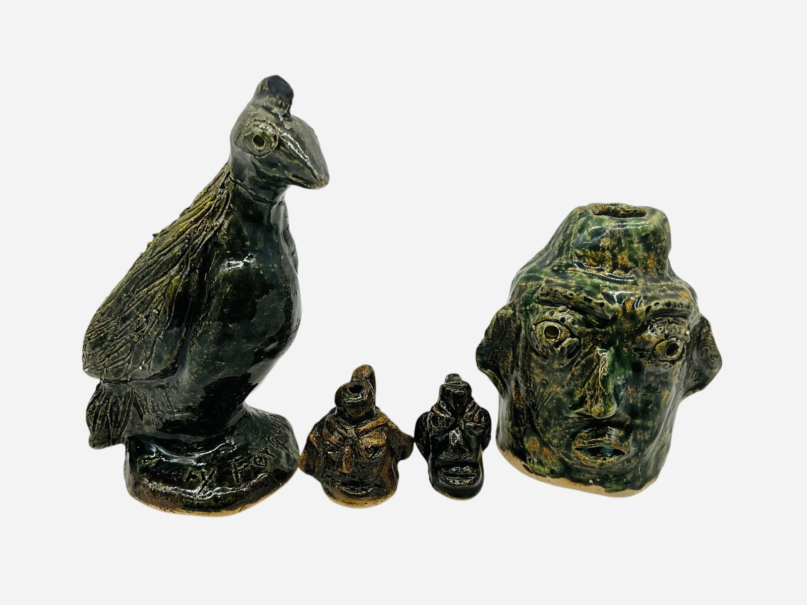 Four Small Works - Mary Ferguson: Four smalls/minis total. All in mint condition and signed. Two mini face jugs, a small bird and small face jug. Largest piece stands 4.25 inches. Smallest piece stands 1.25 inches.