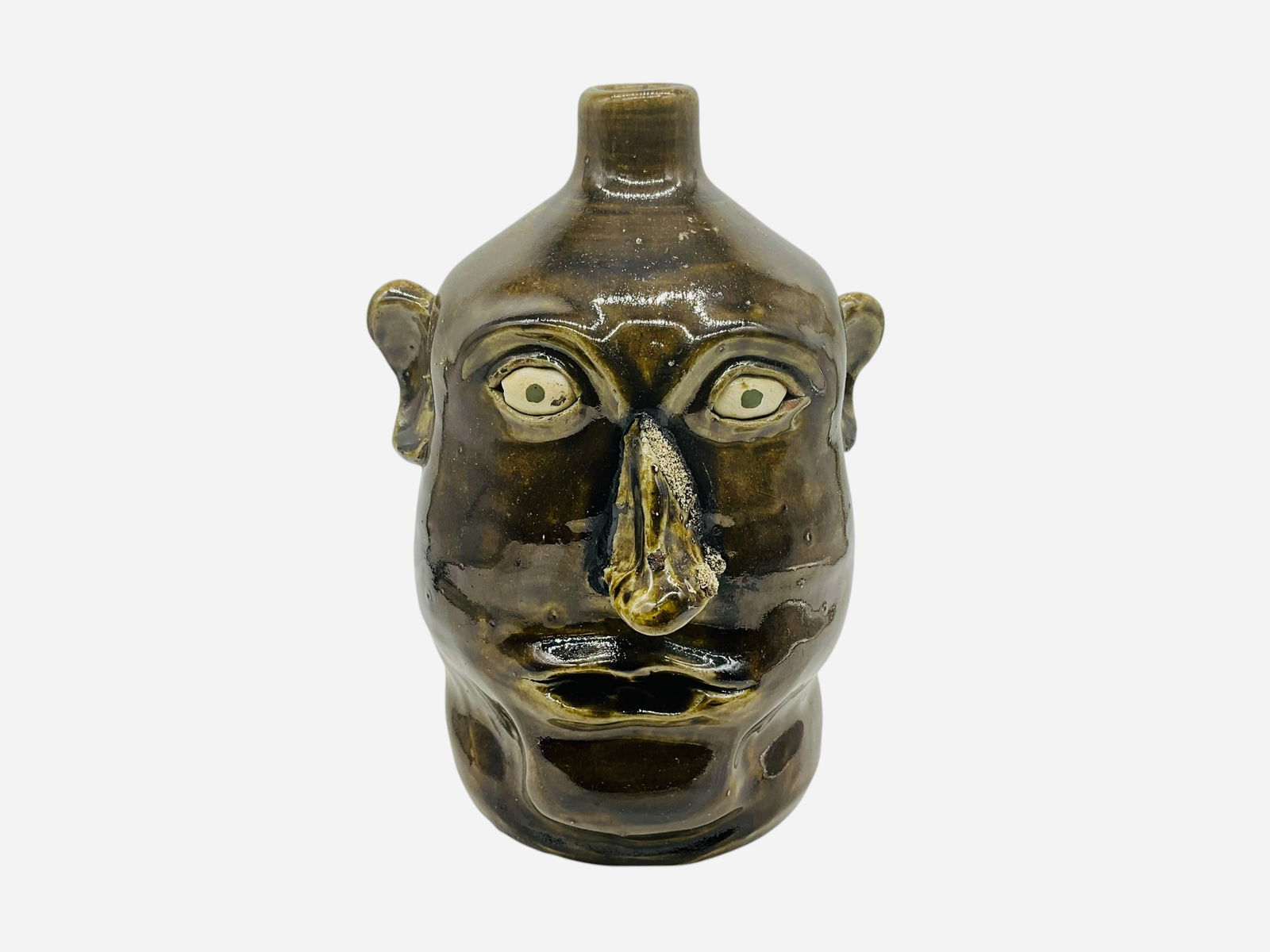 David Meaders 100 Years Face Jug: Mint condition. Signed and dated on back. "100 years of making Meaders Pottery" incised on back. Measures 10"H x 7"L x 7"W.