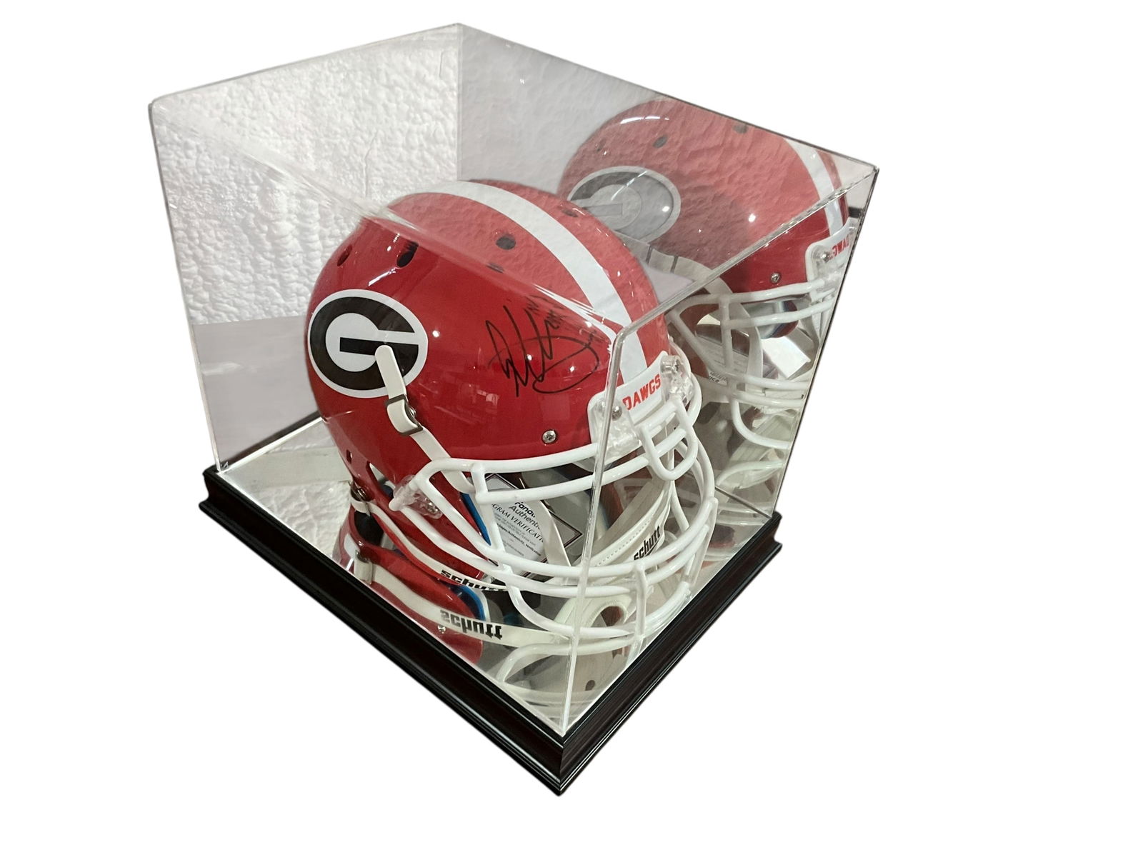 Todd Gurley Autographed UGA Helmet in Showcase: Excellent condition. Full sized helmet. COA from Fanatics included. Mirrored showcase included. Measurements of showcase: 13.75"H x 15.25"L x 12"W.