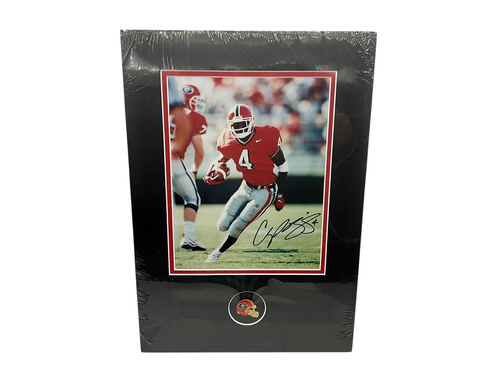 Champ Bailey Autographed UGA Photo: Mint condition. Matted to be framed and sealed. UGA helmet pin included below photo. COA included on back. Measures 16.75" x 11 5/8".