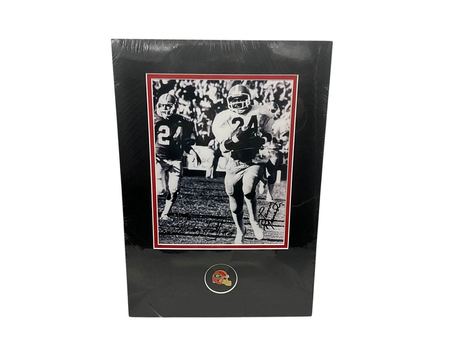 Larry Munson & Lindsey Scott Autographed UGA Photo: Mint condition. Matted to be framed and sealed. The infamous "Run Lindsey Run" photo. UGA helmet pin included below photo. COA included on back. Measures 16.75" x 11 5/8".