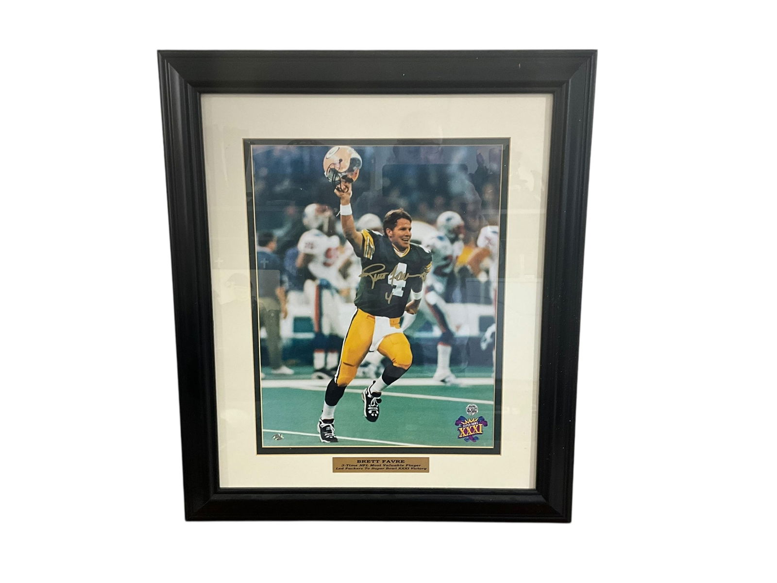Framed Brett Favre Signed Photo - Super Bowl XXXI: Excellent condition. Matted and framed photo from Super Bowl XXXI. Stacks of Plaques COA on back. Measures 28 3/8" x 24 3/8".