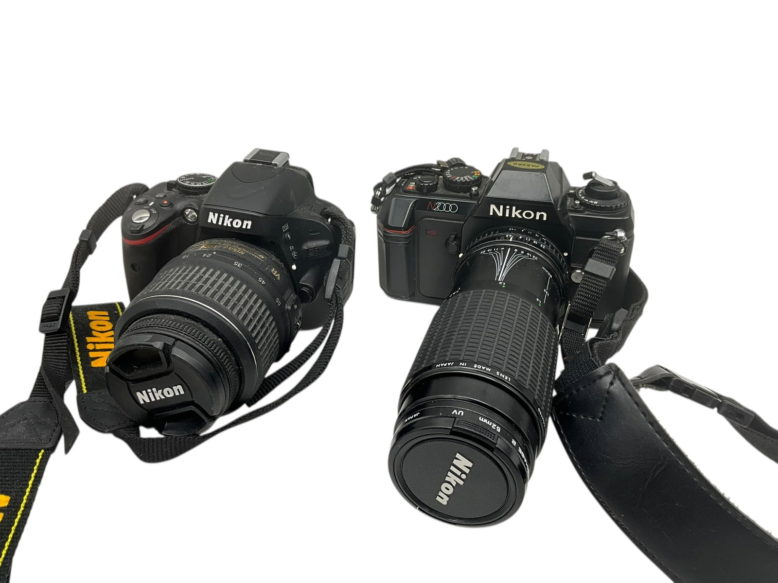 Nikon N2000 & Nikon D5100 Cameras w/ Lenses: Both cameras are untested and appear to be in good condition. Nikon D5100 has Nikon DX 18-55mm lens attached. Nikon N2000 has Nikon Zoom lens attached. Buying as is.
