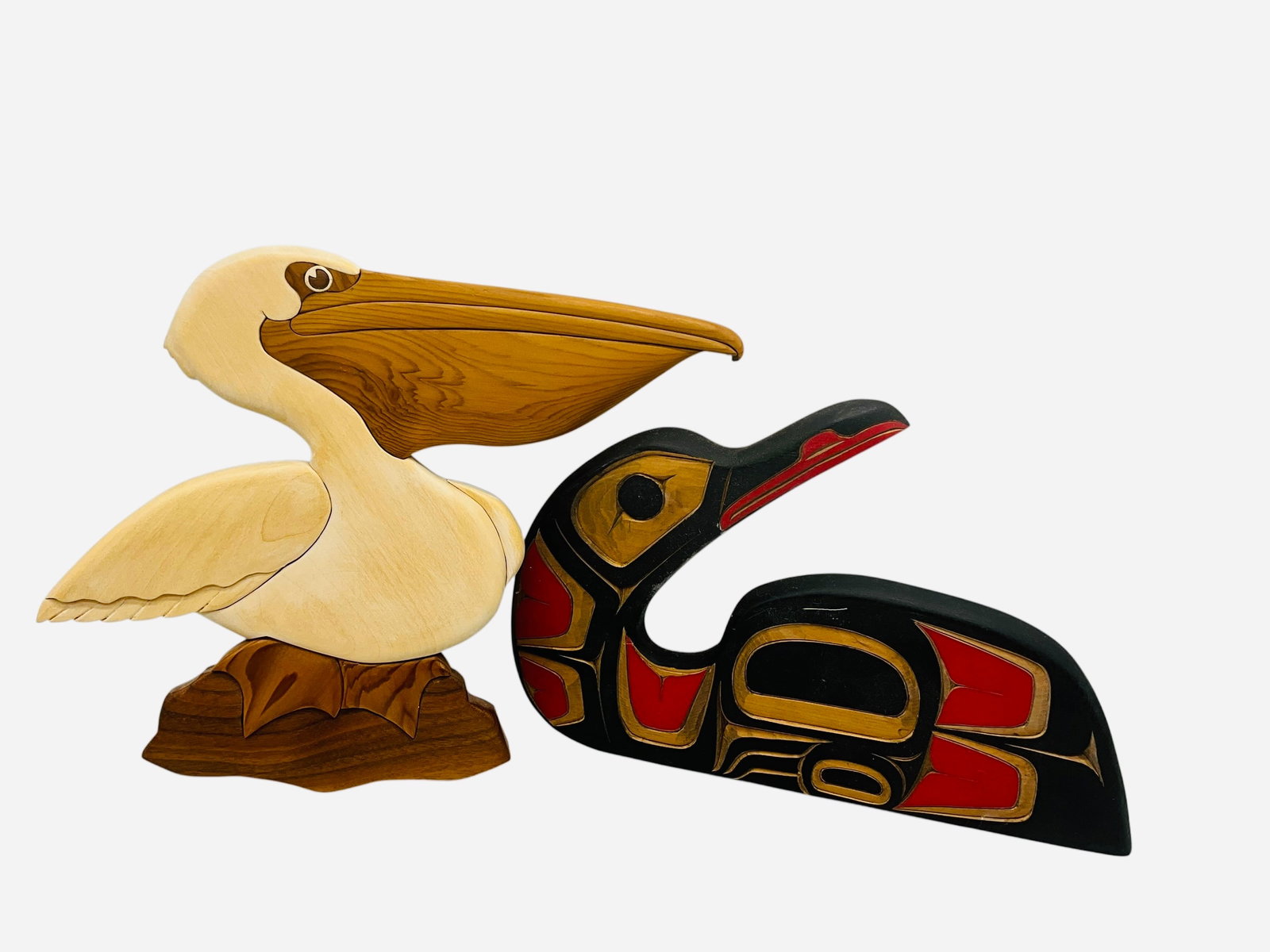 Two Wood Carved Birds - Joe Campbell & Other: Excellent condition. Loon by Joe Campbell is signed on back. Measures 7.75" x 11.75". Toucan is signed on back and dated 2014. Unable to determine maker. Measures 10" x 10". 