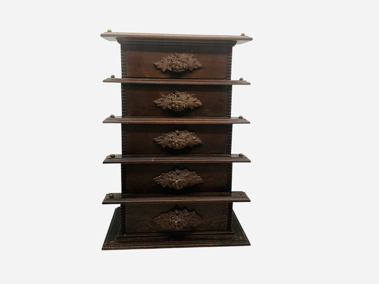 Vintage Carved Wood Acorn And Leaf 5 Drawer Cabinet: Graduated drawers. 22 inches tall x 9 1/2 inches deep. 15 1/2 inch wide base. Looks to be Walnut. 3 small pegs/buttons missing. 
