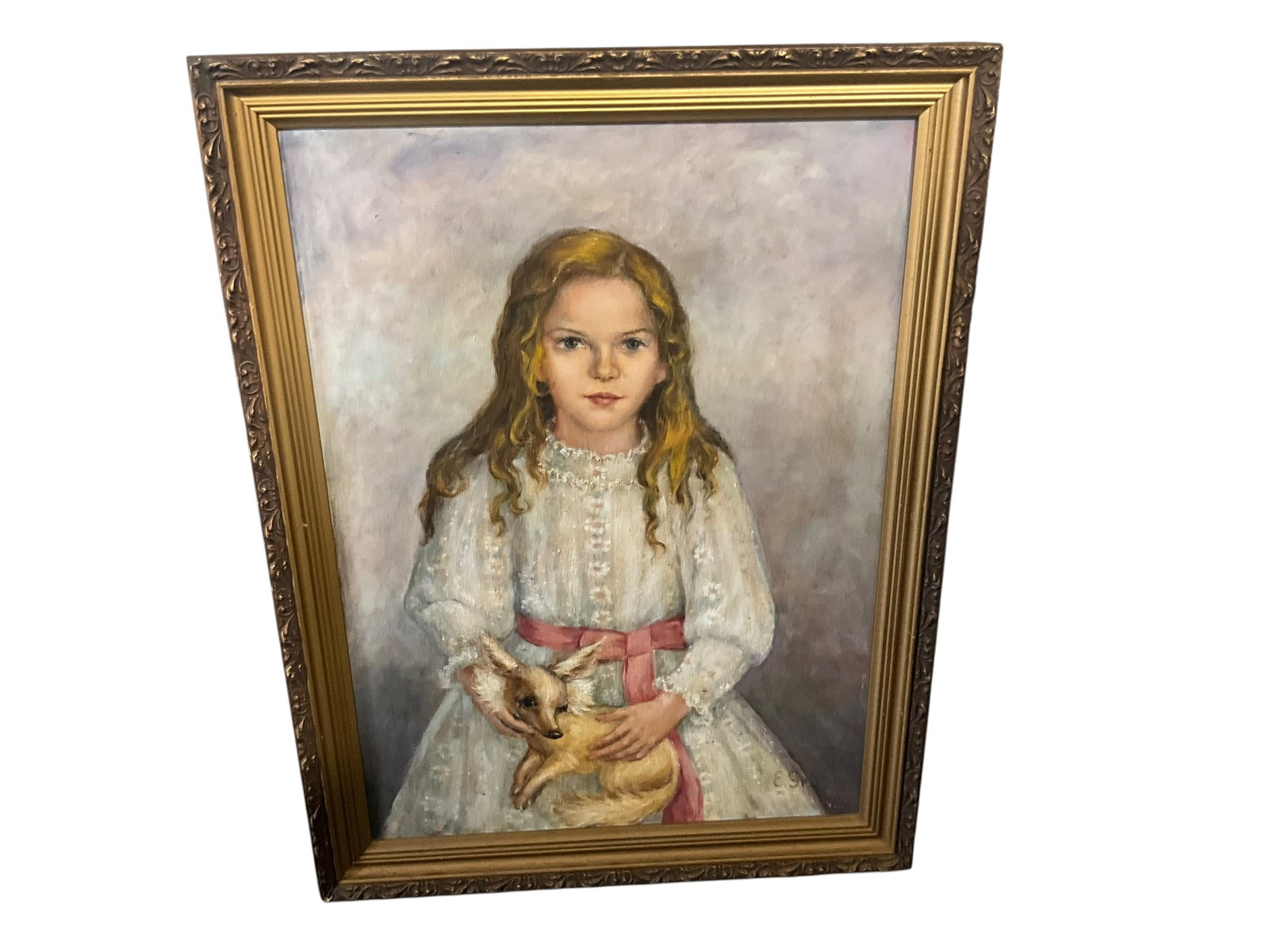 Oil on Canvas - Girl with Dog: Beautifully framed original oil on canvas of a young girl holding a dog. Artist signed on bottom right. Appears to read 'E. Gruzis' but not 100% certain. Dated 1973. Measures 34" x 26".