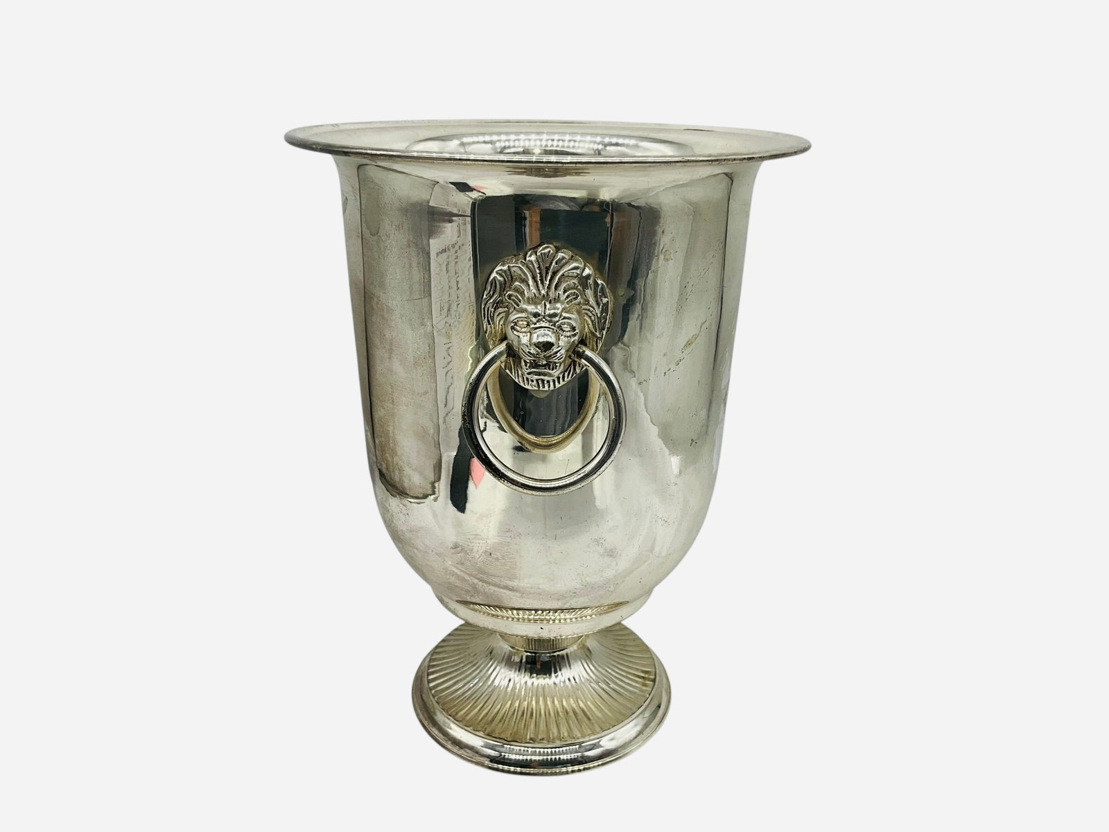 Silver Plate Ice Champagne Bucket: An excellent silver plated ice bucket with lion head handles. Overall good condition. Could use a good polishing. Stands 10.75 inches with a diameter of 8.25 inches.