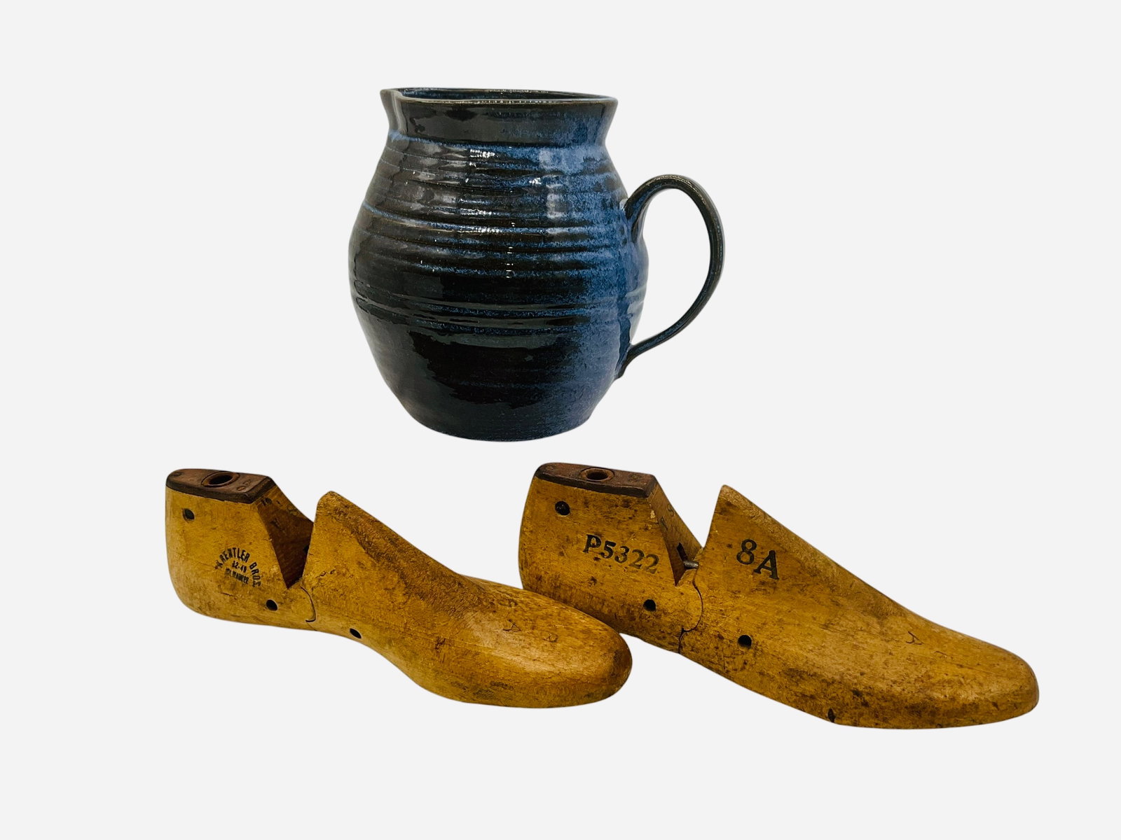 Studio Pottery Pitcher & Krentler Bros Shoe Molds: Pitcher in mind condition. Signed and dated on bottom. Unable to determine maker. Stands 7.5 inches. Pair of Krentler Bros wooden cobbler shoe forms. Each is 9.5 inches long.
