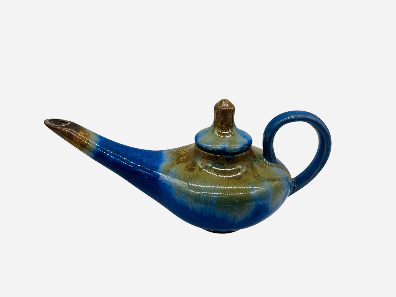 Pigeon Forge Pottery D. Ferguson Genie Lamp: A great piece by Douglas Ferguson of Pigeon Forge Pottery. Stopper included. Signed on bottom. Measures 4.5"H x 9.5"L x 4"W.