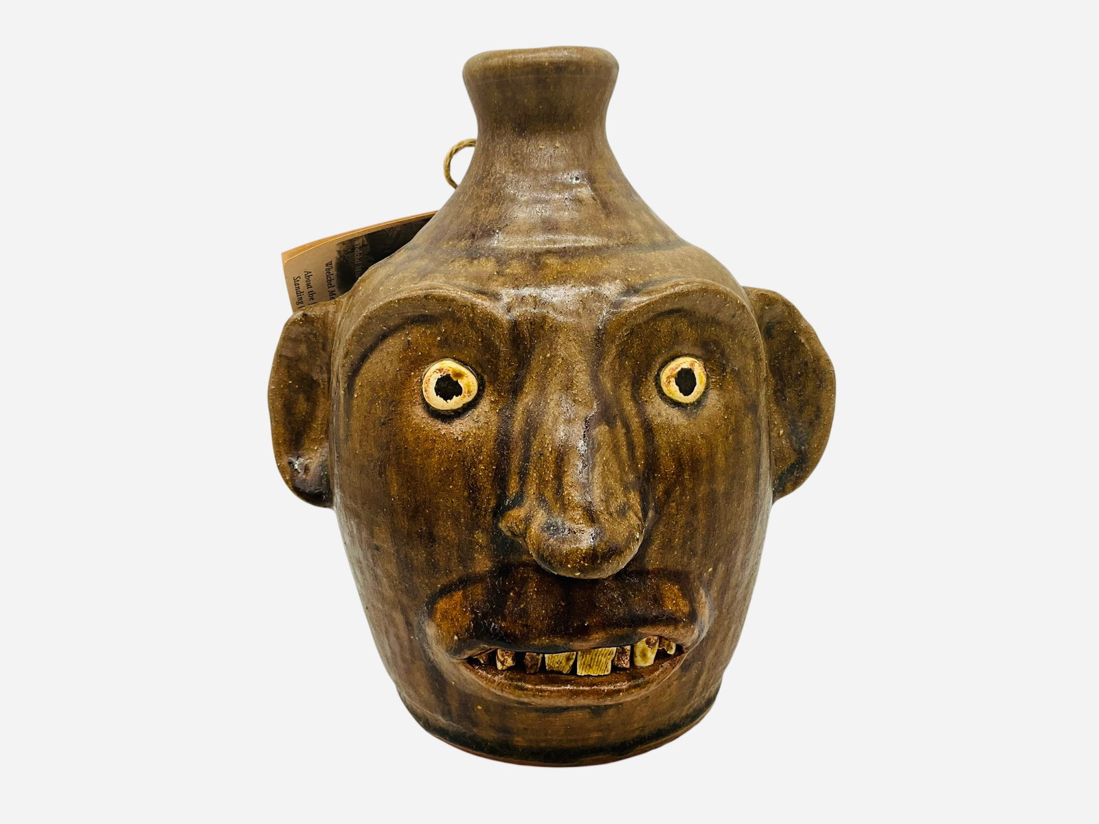 Whelchel Meaders Face Jug: Mint condition. Signed on bottom. Hang tag included. Stands 8.75 inches.