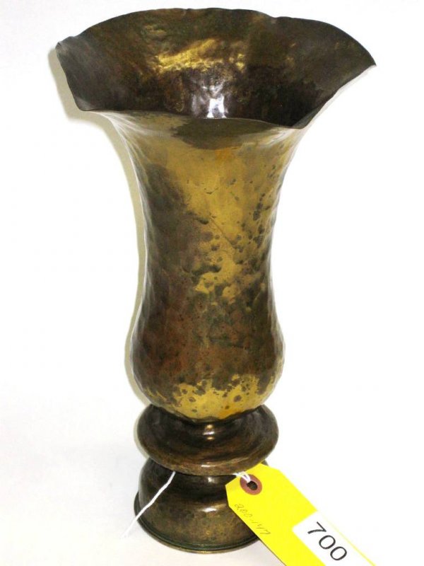 MILITARY SHELL VASE: HAMMERED BRASS FLORAFORM VASE IN VAN ERP STYLE. MILITARY SHELL CASE - UNDATED - ORIGINAL OLD BRASS SURFACE WITH SPOTTING. OVERALL GOOD CONDITION. MINOR DINGS TO RIMS. 11 1/2'' EST. 500-700