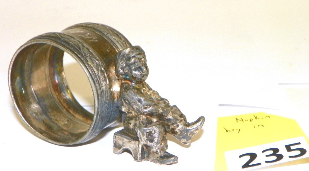 VICTORIAN SILVERPLATE NAPKIN RING HOLDER: VICTORIAN SILVERPLATE NAPKIN RING HOLDER - SITTING BOY IN FRONT - GOOD CONDITION MONOGRAMED - 1 7/8'' TALL X 3'' LONG