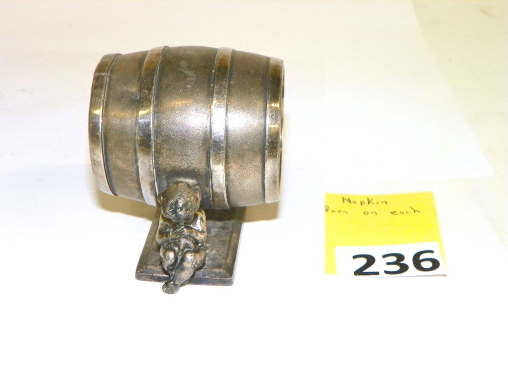 MERIDEN SILVERPLATE NAPKIN RING HOLDER: MERIDEN SILVERPLATE NAPKIN RING HOLDER - CHILDREN ON EACH SIDE OF BARREL - GOOD CONDITION - MONOGRAMED AND MARKED ON BOTTOM - 2 1/8'' TALL X 3'' LONG