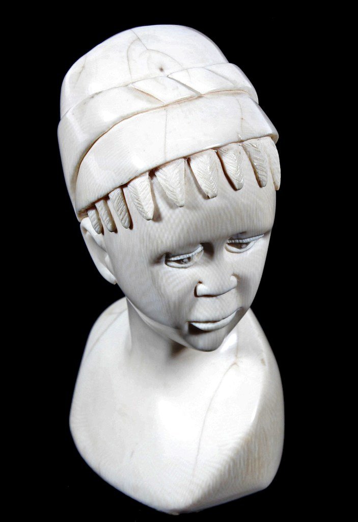 IVORY BUST: LARGE IVORY BUST OF AFRICAN MAIDEN STANDS 9 1/2'' TALL AND 5 1/2'' WIDE, SOME CRAZING