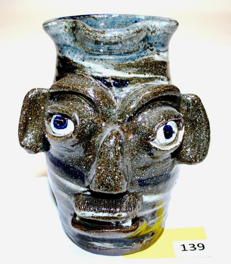 BURLON CRAIG STONEWARE PITCHER: STONEWARE FACE PITCHER SIGNED BURLON CRAIG MEASURING 9'' TALL FROM VALE, NC