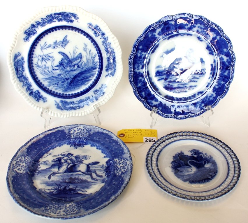 FLOW BLUE PLATES: LOTTED 4 FLOW BLUE PLATES; HORSE & RIDER 10'', GAME BIRD 10 1/2'', TURKEY 10'' AND SWANS 8'' DIAMETER